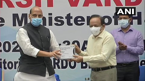 Defence Minister Rajnath Singh handed over the Anti-COVID drug 2DG to Union Health Minister Dr Harsh Vardhan (Photo | ANI)