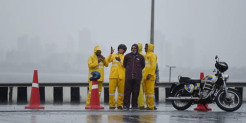 Police personnel stand at the entry of Bandra-Worli sea link, which was closed due to the formation of cyclone Tauktae in Mumbai. (Photo| PTI)