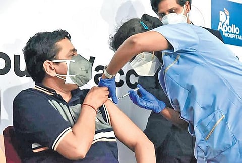 A health worker administers Sputnik V vaccine to an employee of Dr Reddy’s Lab, as part of the Apollo Group of Hospitals’ pilot project, in Hyderabad.