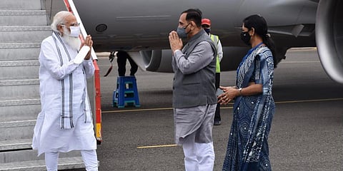 PM Modi greets Gujarat CM Vijay Rupani on landing in Bhavnagar. (Photo| Twitter/ @vijayrupanibjp)