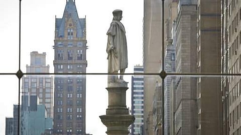 The Christopher Columbus statue at Manhattan's Columbus Circle, center, is shown from a view inside the Time Warner Center, in New York. (AP Photo)