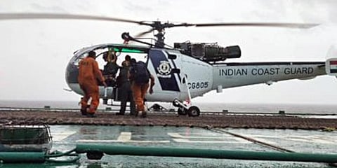 Indian Coast Guard Chetaks launched from Daman have successfully airlifted 10 crew from grounded Barge Gal Constructor. (Photo | ANI)