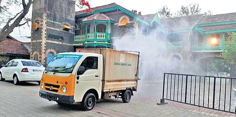 RPD College premises being sanitised by corporation staff on the eve of counting of votes in Belagavi on Saturday | EXPRESS