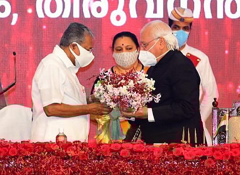 Governor Arif Mohammad Khan greets Chief Minister Pinarayi Vijayan after the latter was sworn in at Central Stadium in Thiruvananthapuram on Thursday (Photo | PRD)