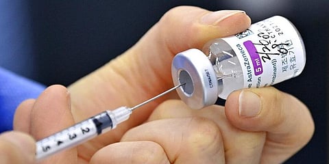 A nurse fills a syringe with the AstraZeneca COVID-19 vaccine. (Photo | AP)