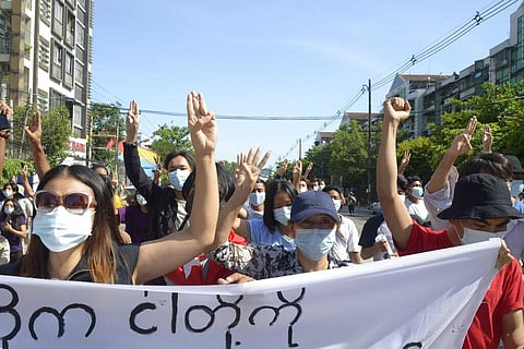 Anti-coup protesters flash the three-finger salute during a demonstration in Yangon, Myanmar, Friday, May 14, 2021. (Photo | AP)