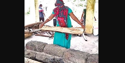 Madhusmita Prusty arranges wood at a crematorium | Express
