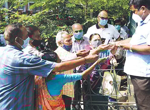 Tokens being distributed for vaccination (Photo | Vinod kumar.T, EPS)