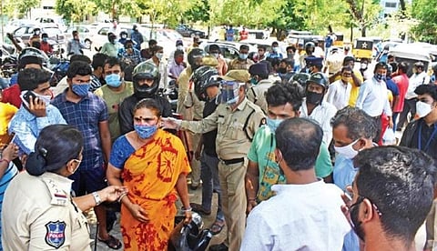 Several motorists argue with the police after their vehicles are seized during lockdown hours at Begumpet in Hyderabad on Saturday. (Photo | S Senbagapandiyan, EPS)