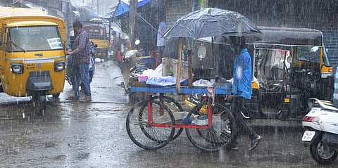 Heavy rain amid the triple lockdown came as a huge blow to traders and the public at Chalai market in Thiruvananthapuram. (Photo | B P Deepu, EPS)
