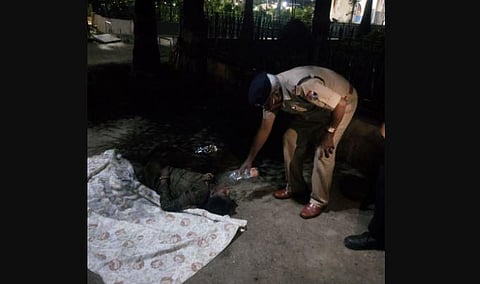 Railway Protection Force personnel offering water to the woman abandoned at KSR railway station in Bengaluru by her family (Photo | EPS)