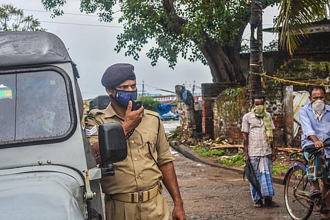 A cop issues safety warning in view of the cyclonic storm Yaas in Odisha. (Photo | Express)