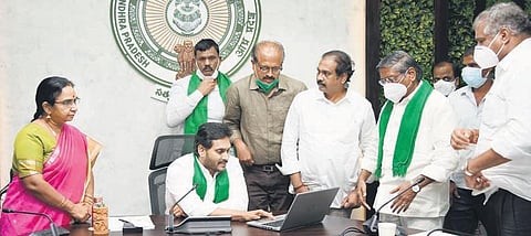 Chief Minister YS Jagan Mohan Reddy releases crop insurance from his camp office in Tadepalli on Tuesday I Express