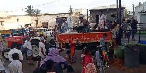 Video grab showing villagers filling up a trolly with cooked rice in D Kolagallu village of Ballari.