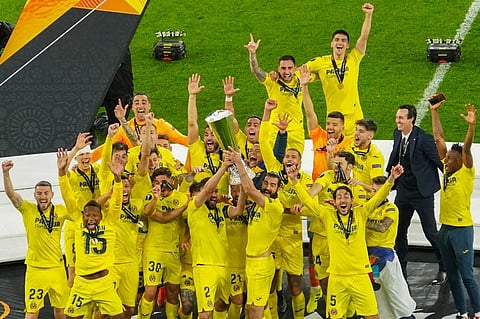Villarreal players hold up their trophy as they celebrate winning the 2021 UEFA Europa League.