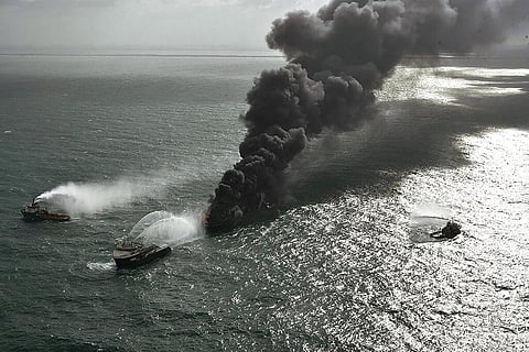 smoke rises from the container vessel MV X-Press Pearl engulfed in flames off Colombo port, Sri Lanka. (Photo | AP)