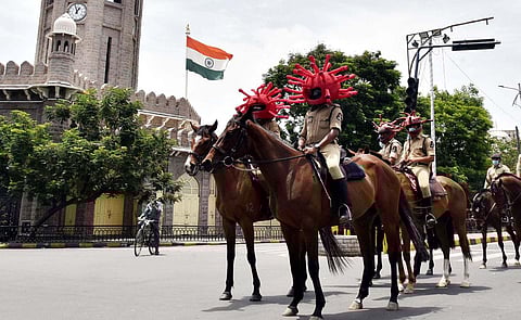Mounted police force officers sport Coronavirus headgear during an awareness campaign in Hyderabad. (Photo | RVK Rao, EPS)