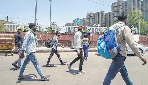 Migrant workers return to Delhi, as city’s Covid-19 situation gets gradually better, at Anand Vihar ISBT in New Delhi on Thursday | PTI