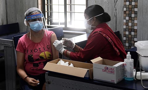 A beneficiary gets the vaccine at a COVID-19 vaccination centre in New Delhi. ( Photo | Parveen Negi, EPS)