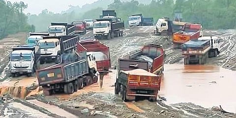 Vehicles stuck in the damaged NH-520 stretch
