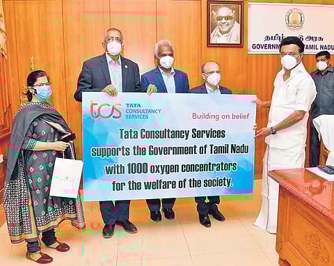 Tata Consultancy Services president (Administration) S Kumaran and vice-president Suresh, along with other staff, on Saturday met Chief Minister MK Stalin and donated 1,000 oxygen concentrators | Expr