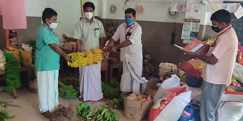 Panchayat members of Panathady take stock of the items donated by residents at the larder of their community kitchen run from Government Higher Secondary School, Balanthode. (Photo| EPS)