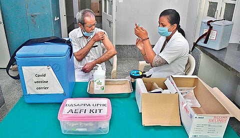A senior citizen gets a Covid vaccine shot in Bengaluru. (Photo | Express)