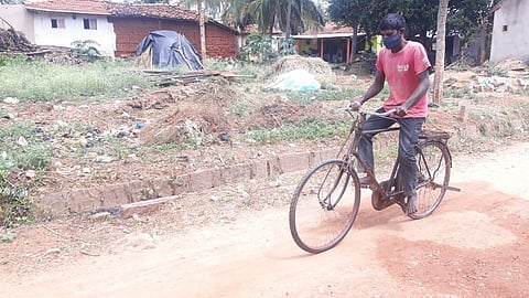 Anand riding a bicycle on way to Bengaluru. (Photo | EPS)