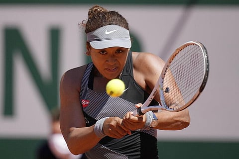 Japan's Naomi Osaka returns the ball to Romania's Patricia Maria Tig during their first round match of the French open tennis tournament at the Roland Garros stadium. (Photo | AP)