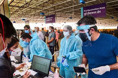 People over 18 years of age wait to receive COVID-19 vaccine doses at Radha Soami Satsang, India's largest COVID-19 vaccination centre, in New Delhi. (Photo | PTI)