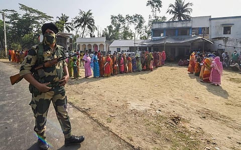 Voters stand in queues to cast their votes during the second phase of West Bengal Assembly polls, in Nandigram, Thursday, April 1, 2021. (Photo | PTI)