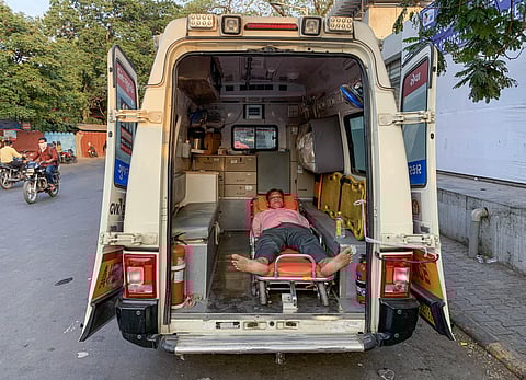 (For representational purposes) A COVID-19 patient receives primary treatment inside an ambulance at the COVID-19 OPD of the Government Civil Hospital, in Ahmedabad. (Photo | PTI)