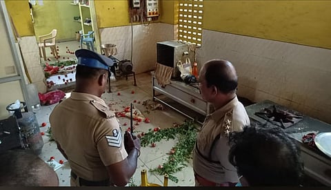 Police inspecting the Amma Canteen that was vandalised (Photo | Special arrangement)