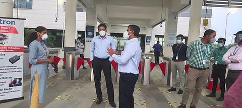 Kolar DC Dr Selvamani and SP Karthick Reddy speaking to workers in Wistron (Photo | Special arrangement)