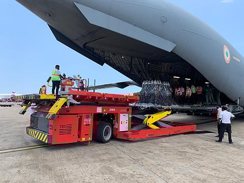 Officials unload COVID-19 relief material brought to Chennai by the Air Force from the United Kingdom in a long-haul flight. (Photo | Special Arrangement)