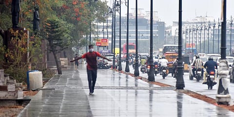 A man enjoys the rain in Hyderabad. (Photo| EPS)