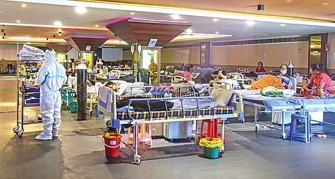 Health workers attend to Covid-19 patients at a temporary facility near LNJP Hospital on Wednesday | PTI