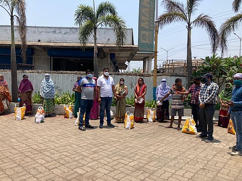 RMC team distributing ration packets to poor families amid lockdown (Photo | Express)