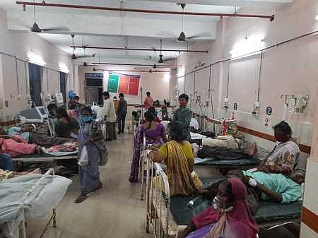 A crowded ward in the GGH in Kakinada with two patients sharing a bed | Express