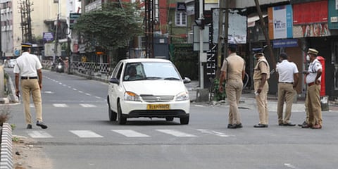 Police check on vehicles at MG road in Kochi as part of the the weekend restrictions issued by the state government. (Photo| Arun Angela, EPS)