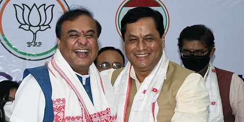 Assam's Chief Minister-designate Himanta Biswa with Sarbananda Sonowal during a BJP Legislative party meeting in Guwahati. (Photo | ANI)