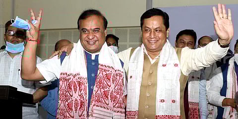 Assam's Chief Minister-designate Himanta Biswa with Sarbananda Sonowal during a BJP Legislative party meeting in Guwahati. (Photo | ANI)