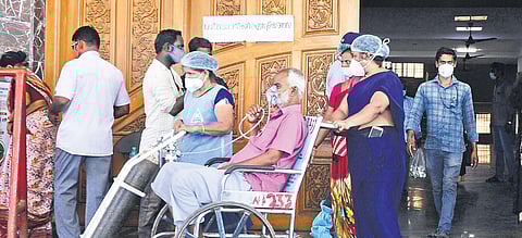A patient is wheeled out of the Corona Outpatient Department at RGGGH in Chennai on Saturday. (Photo | Debadatta Mallick/EPS)