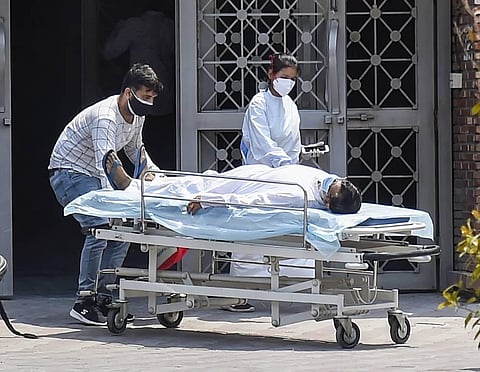 A COVID-19 patient arrives for treatment at LNJP Hospital in New Delhi, Thursday, May 6, 2021. (Photo | PTI)