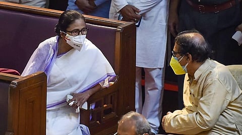 TMC supremo and West Bengal Chief Minister Mamata Banerjee with party leader Biman Bandopadhyay during the swearing-in ceremony of the newly elected MLAs. (Photo | PTI)