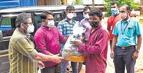 Labour department distributes food kits to migrant workers in Kakkanad