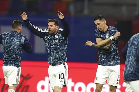 Argentina's Lionel Messi, left, and Angel Di Maria warm up prior to a qualifying soccer match for the FIFA World Cup Qatar 2022 against Chile. (Photo | AP)
