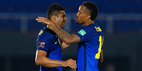 Brazil's Casemiro (L) and Eder Militao, who are also teammates at Real Madrid, celebrate their victory over Paraguay at the end of a World Cup qualifying match. (Photo | AP)