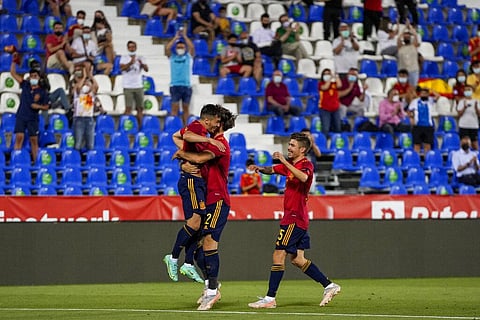 Spain players celebrate after scoring the third goal during the international friendly soccer match against Lithuania. (Photo | AP)