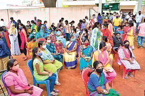 People wait to get inoculated with the Covid-19 vaccine outside a centre in Chikkaballapur on Thursday | KPN
